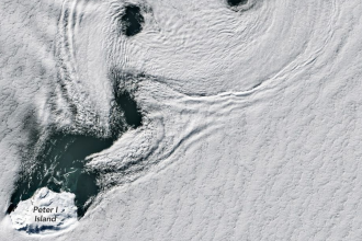 NASA captures a sea of spinning clouds over Antarctica’s remote volcanic island