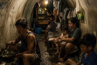 Shocking reality of 100 families living beneath Manila highways in the Philippines