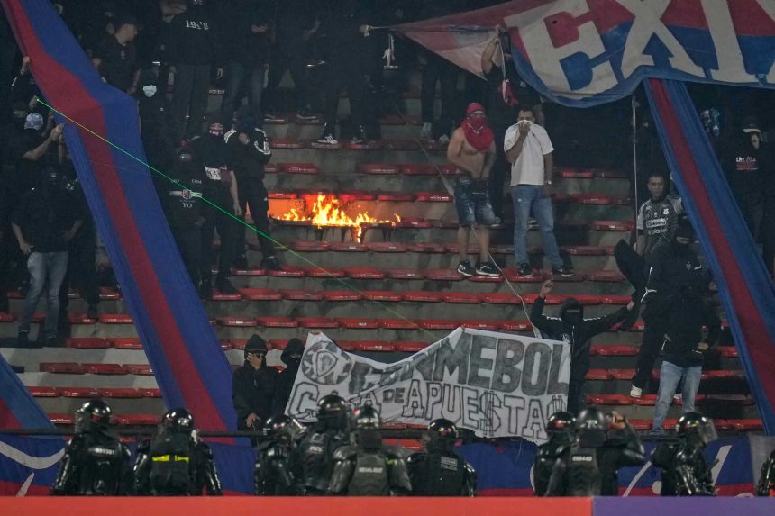 South America’s Champions League match stopped less than 2 mins in after fans started burning stadium sections