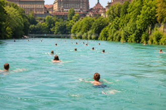 Switzerland’s summer hack: People swim through a river to get home from work