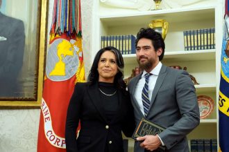 Who is Tulsi Gabbard's husband whose bone cancer cited as reason for resignation amid Iran war row?