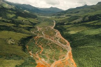 Alaska’s rivers are turning rust-orange and scientists say the cause has been frozen for thousands of years