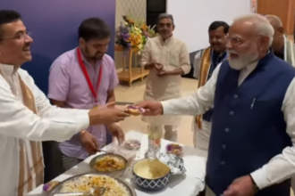Watch: PM Modi enjoys jhalmuri at NDA meeting served by Bengal CM Suvendu Adhikari