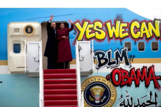A doctored pic of Obamas & Air Force One with graffiti