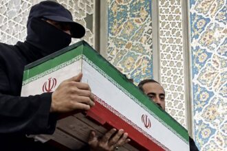 'Who was the masked man?' Khamenei funeral mystery solved
